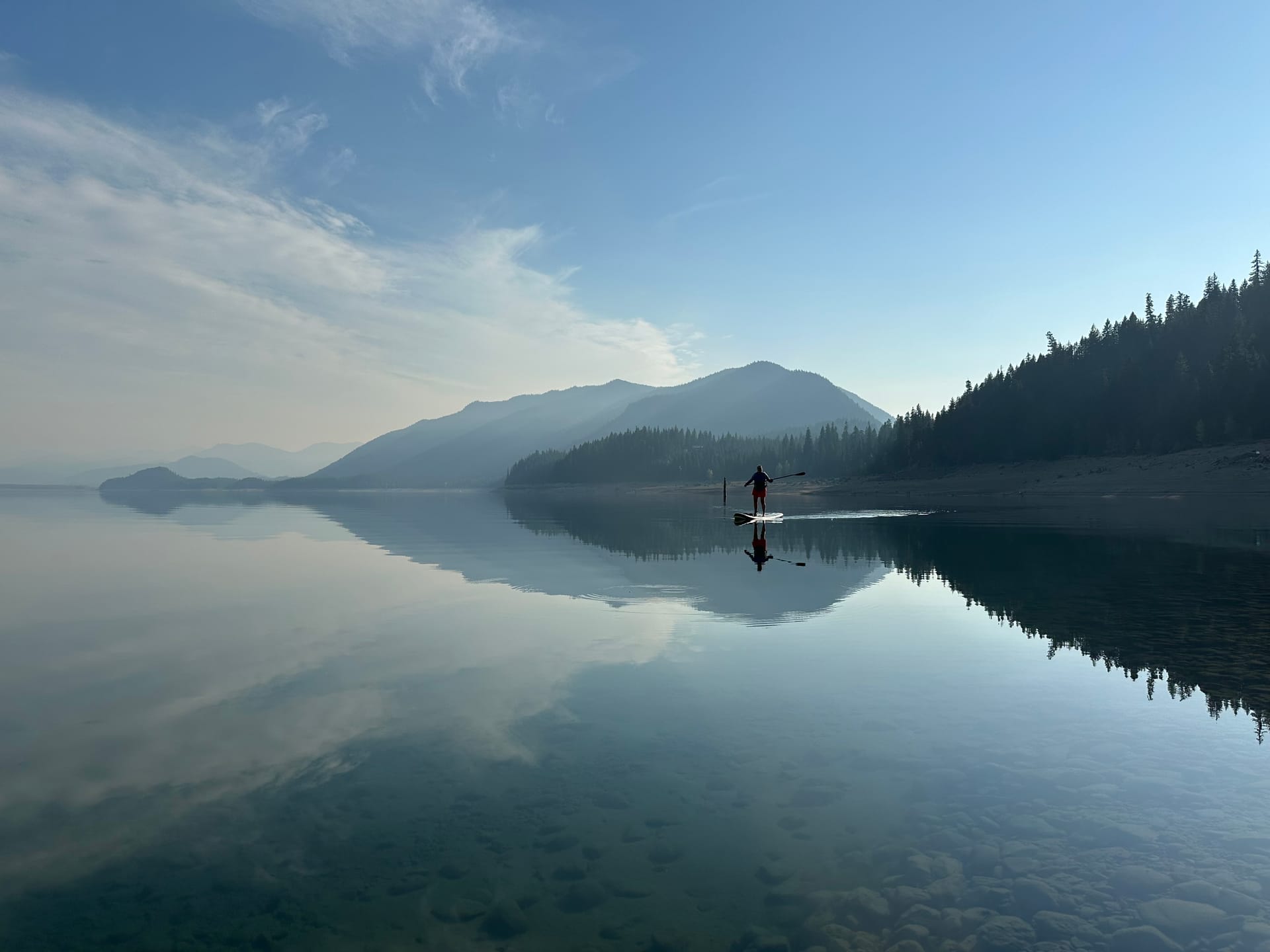 Peaceful mountain lake reflection — a moment of stillness and clarity
